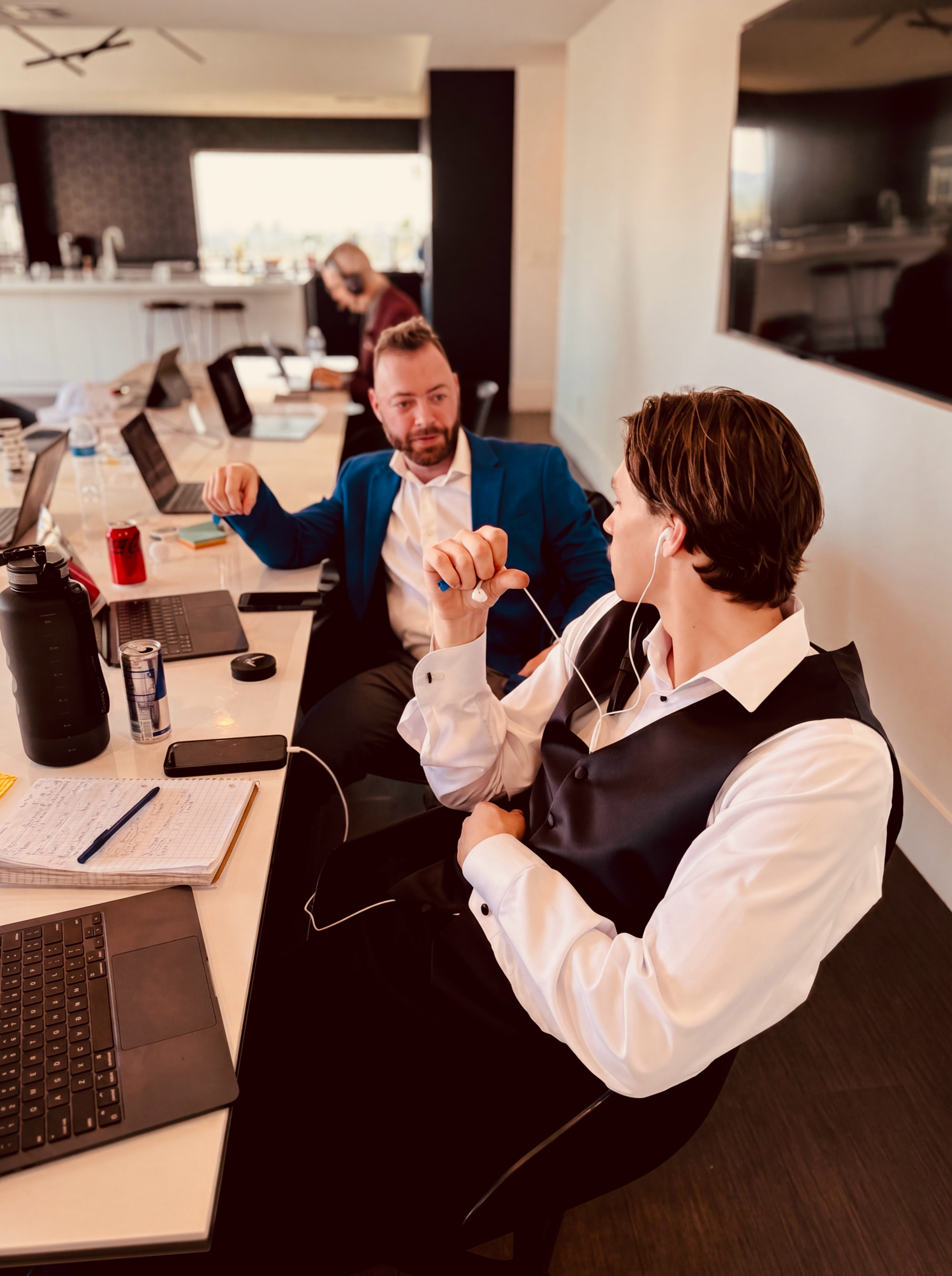 Two Button Up reps talking through a deal at the table