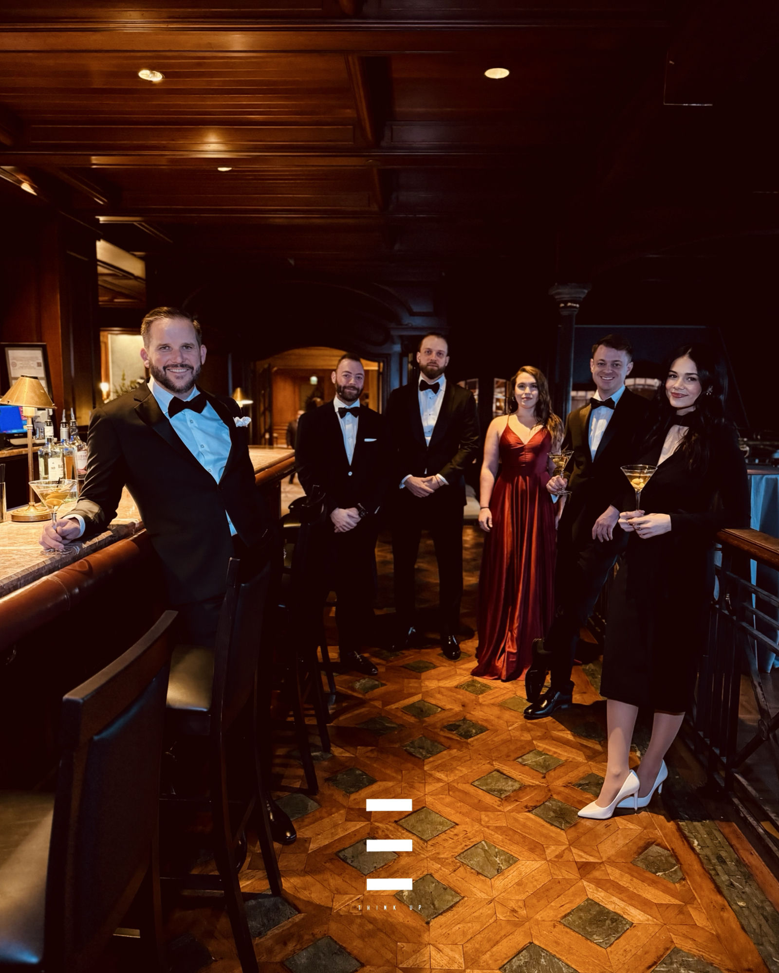 The Button Up team, dressed sharp at an upscale bar