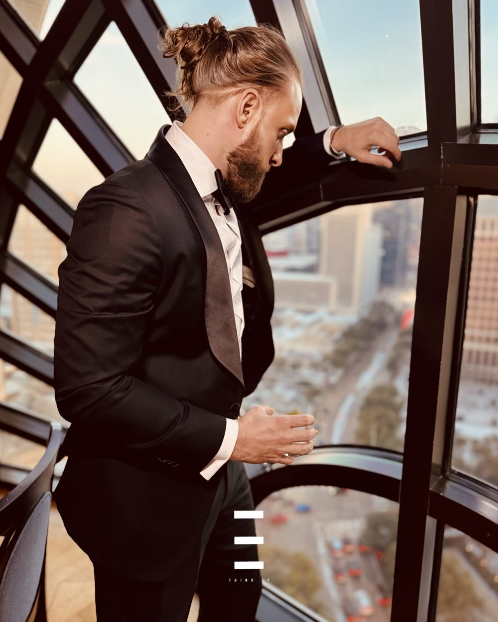 A Button Up operator at a black-tie event overlooking the city